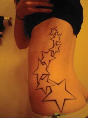 Girls ribcage star tattoos,star tattoo designs,girls tattoo